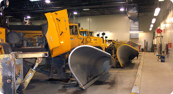 Snow plows in county shop